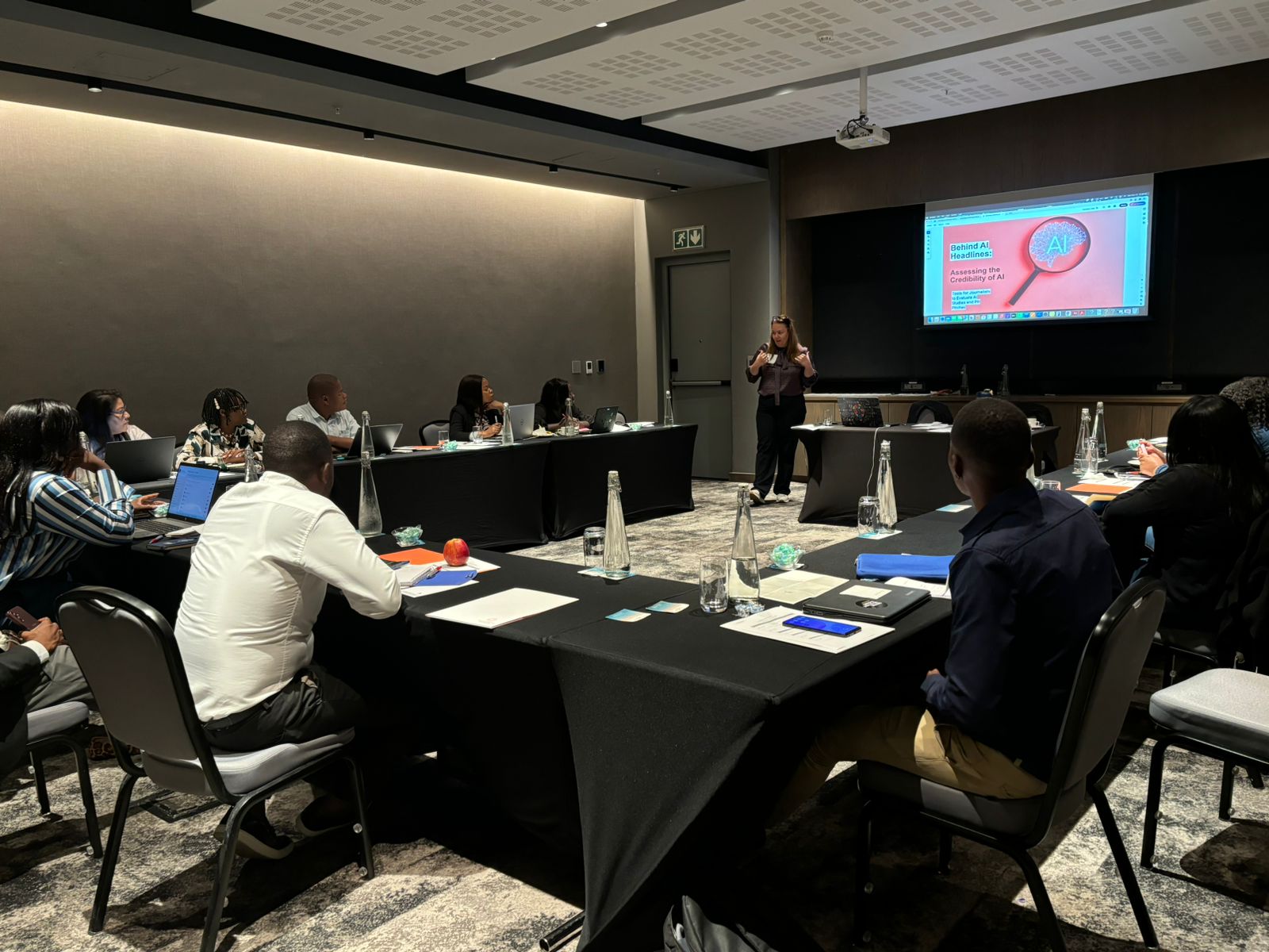 Presenting “Behind AI Headlines: Assessing the Credibility of AI” at a journalism AI training in Nairobi