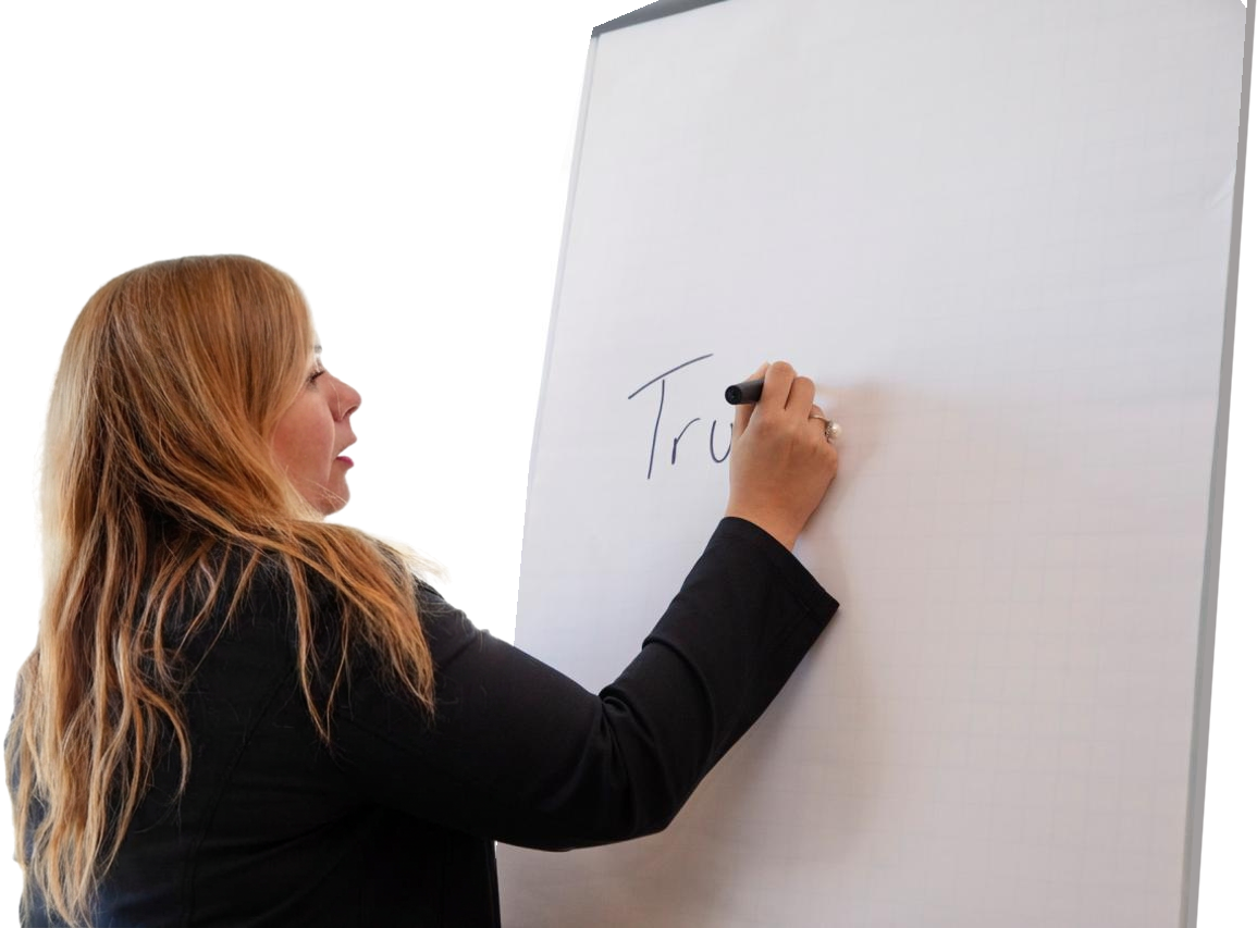 Sara El-Khalili writing at a flip chart
